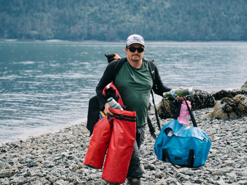 man carrying gear in Homer
