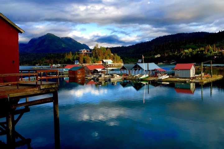 a boat is docked next to a body of water