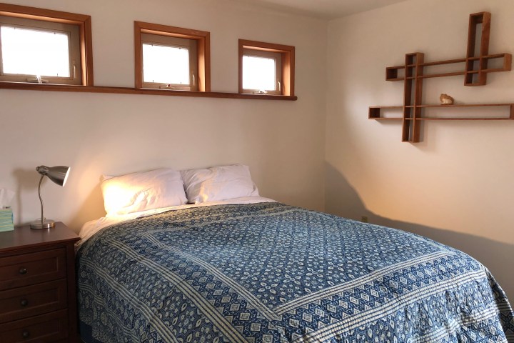 a bedroom with a large bed sitting in a room